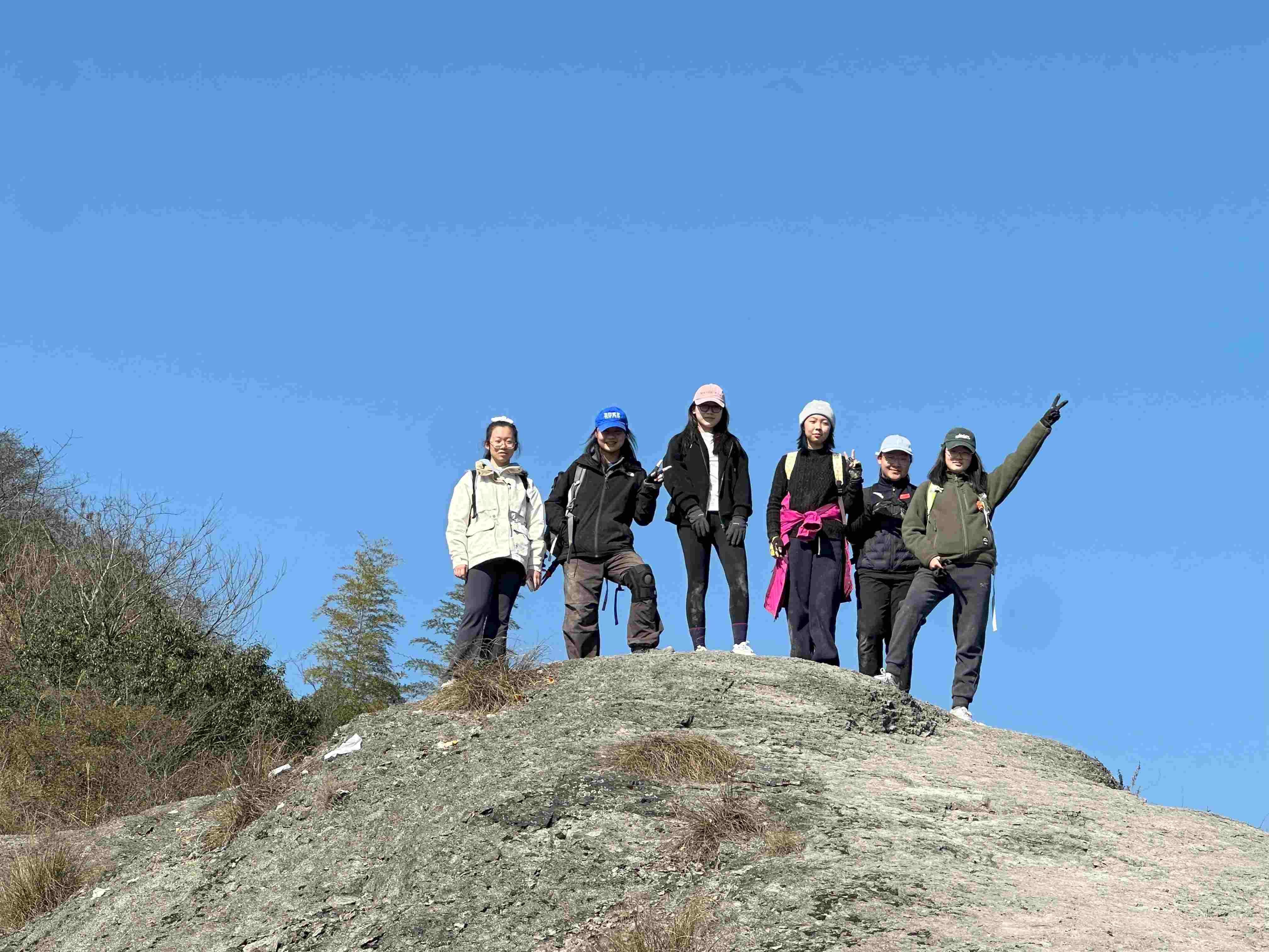 Hiker celebrating at mountain peak