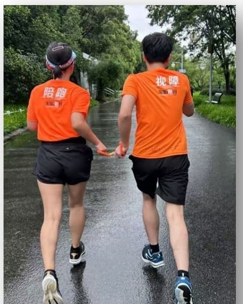 Finish line moment with blind runner